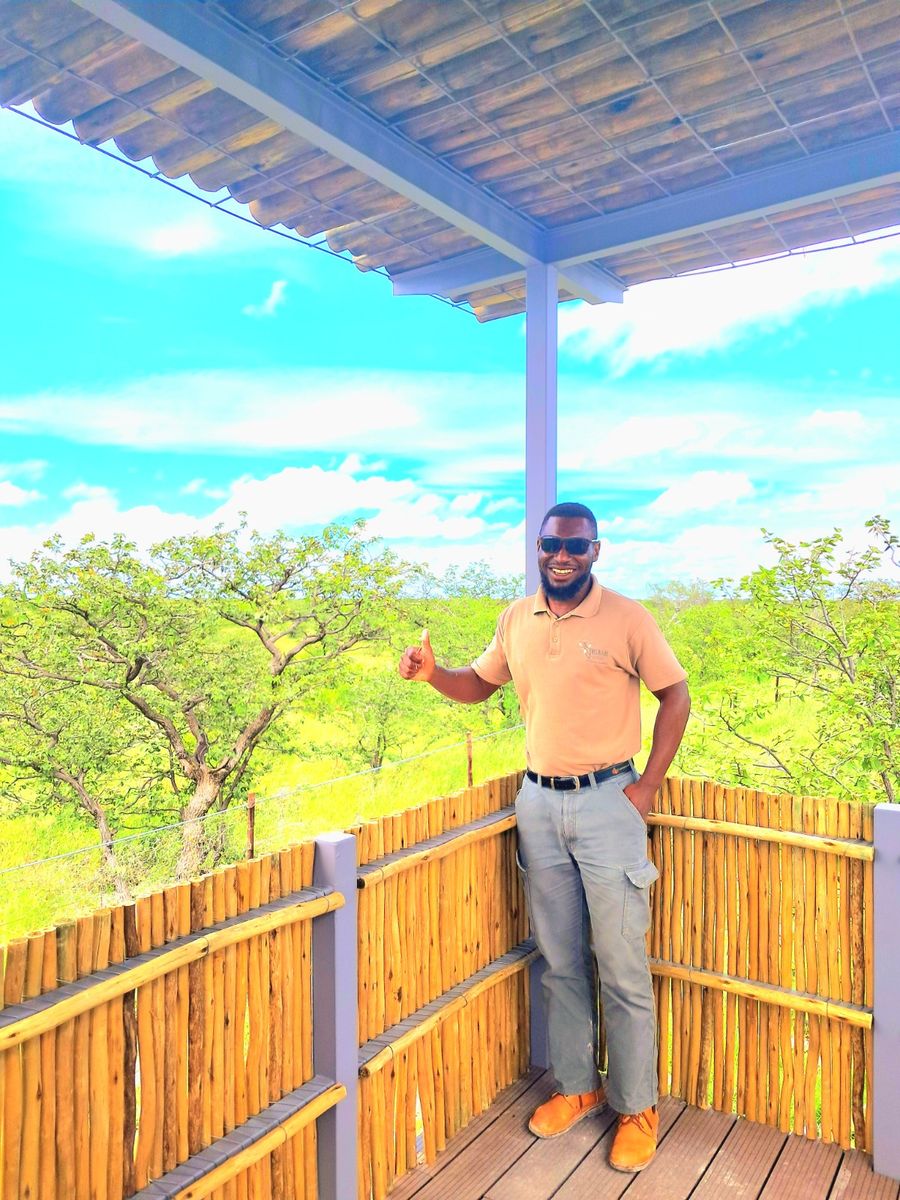 An Oosino guide on a viewing platform in Etosha